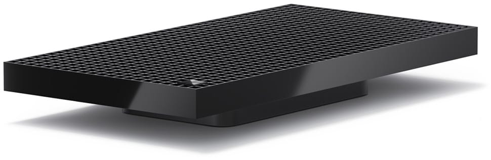 Surface RTX Spark Dev Box, a low black box with a square-grid vent across its top